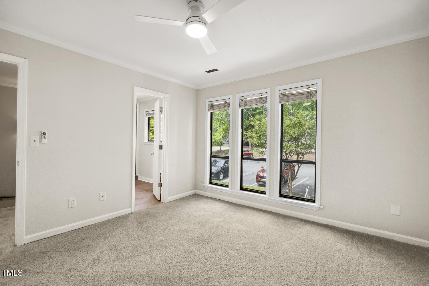 120 Joanne Circle Cary, NC 27513 - Photo 21 of 34 an empty room with windows and ceiling fan