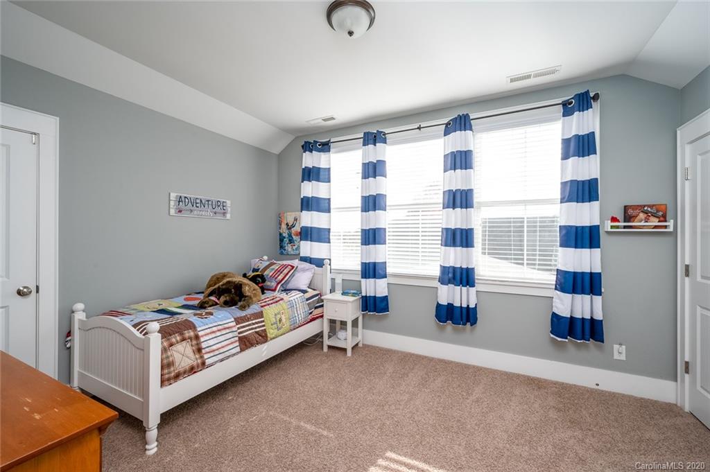 413 Hollyhock Lane Fort Mill, SC 29708 - Photo 12 of 29 a bedroom with furniture and a large window
