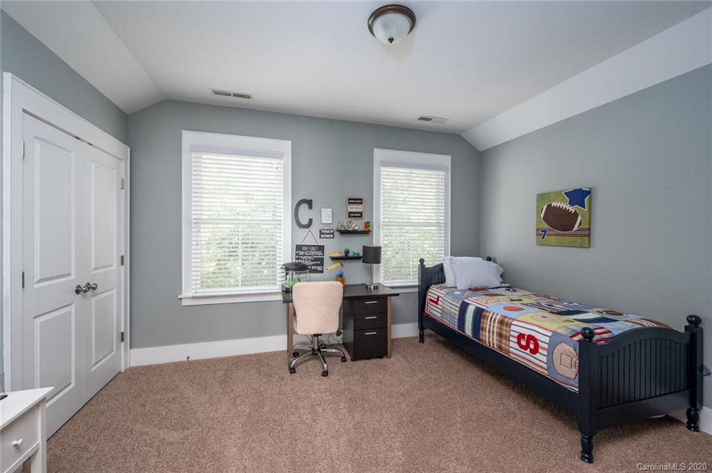 413 Hollyhock Lane Fort Mill, SC 29708 - Photo 14 of 29 a bedroom with a bed and a window