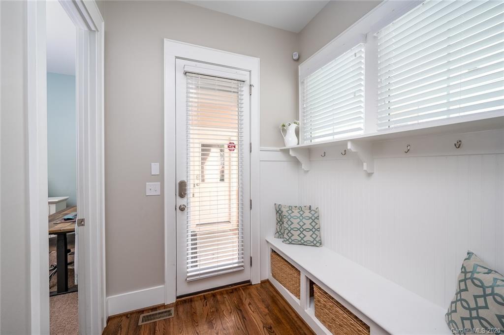 413 Hollyhock Lane Fort Mill, SC 29708 - Photo 15 of 29 a view of hallway with window and wooden floor