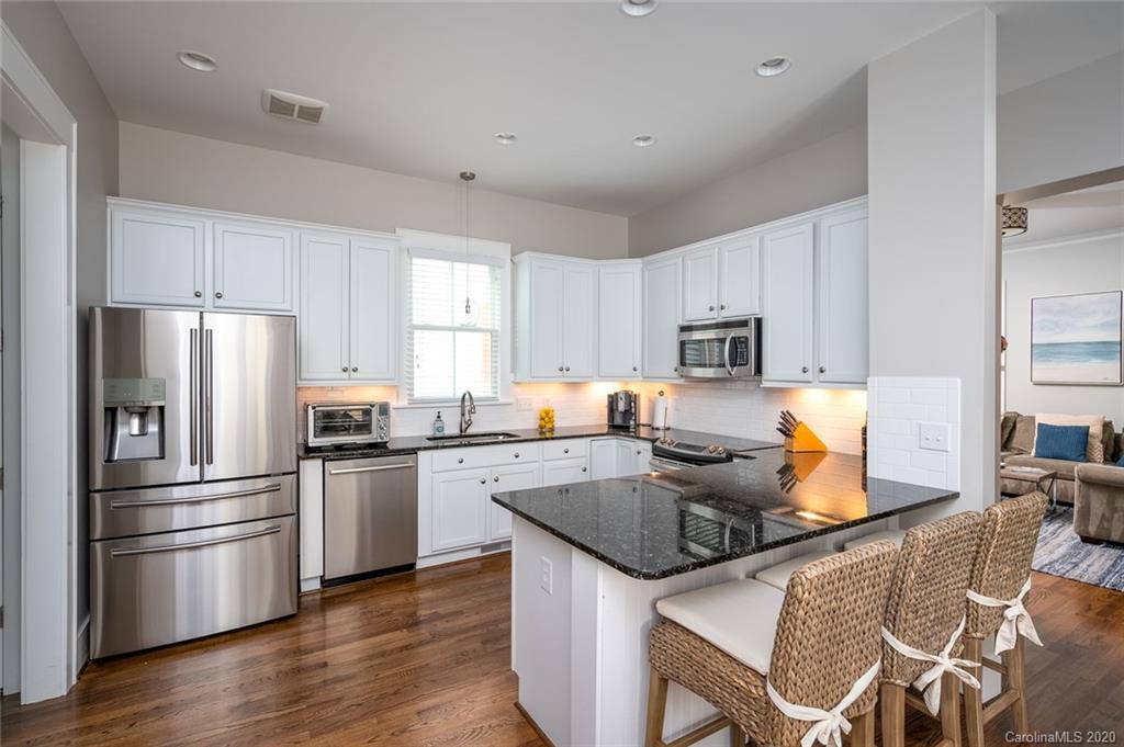 413 Hollyhock Lane Fort Mill, SC 29708 - Photo 6 of 29 a kitchen with stainless steel appliances granite countertop a refrigerator stove microwave and sink