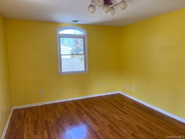 38 Hallock Avenue Smithtown, NY 11787 - Photo 13 of 16 a view of empty room with wooden floor