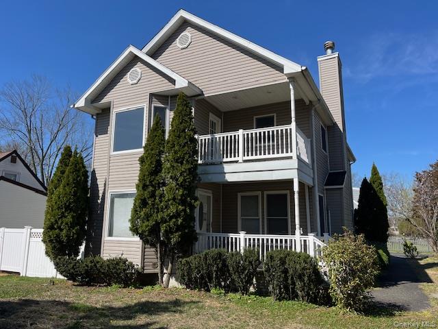 38 Hallock Avenue Smithtown, NY 11787 - Photo 2 of 16 a front view of a house with a yard