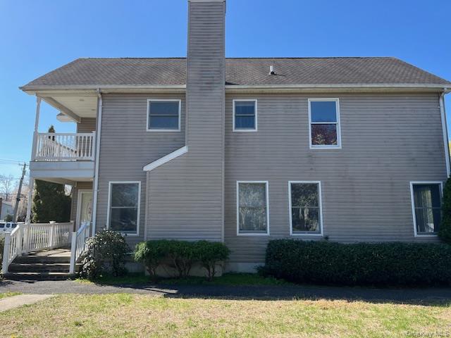 38 Hallock Avenue Smithtown, NY 11787 - Photo 3 of 16 a front view of a house with a yard