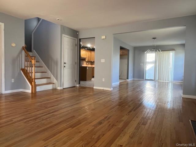 38 Hallock Avenue Smithtown, NY 11787 - Photo 5 of 16 a view of a hallway with wooden floor and staircase