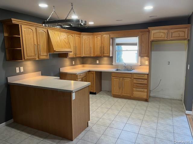 38 Hallock Avenue Smithtown, NY 11787 - Photo 8 of 16 a kitchen with a sink a stove and cabinets