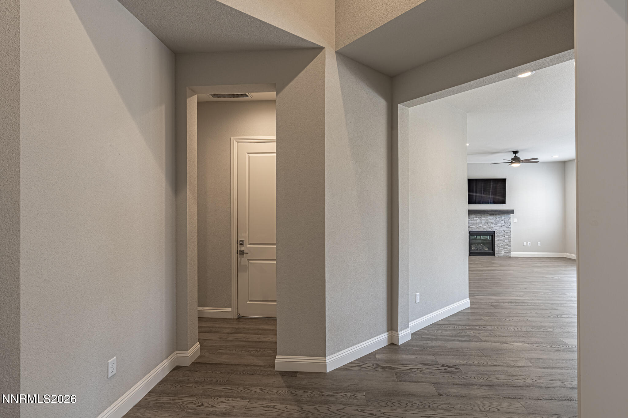 2109 Cast Iron Drive Reno, NV 89521 - Photo 12 of 35 a view of a hallway with wooden floor and a bathroom