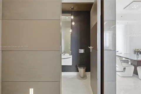 a room with gym equipment and large windows