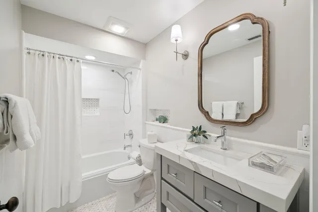 a bedroom with a bed and chair