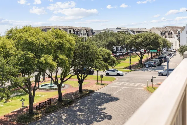 a view of kitchen with stainless steel appliances granite countertop and refrigerator