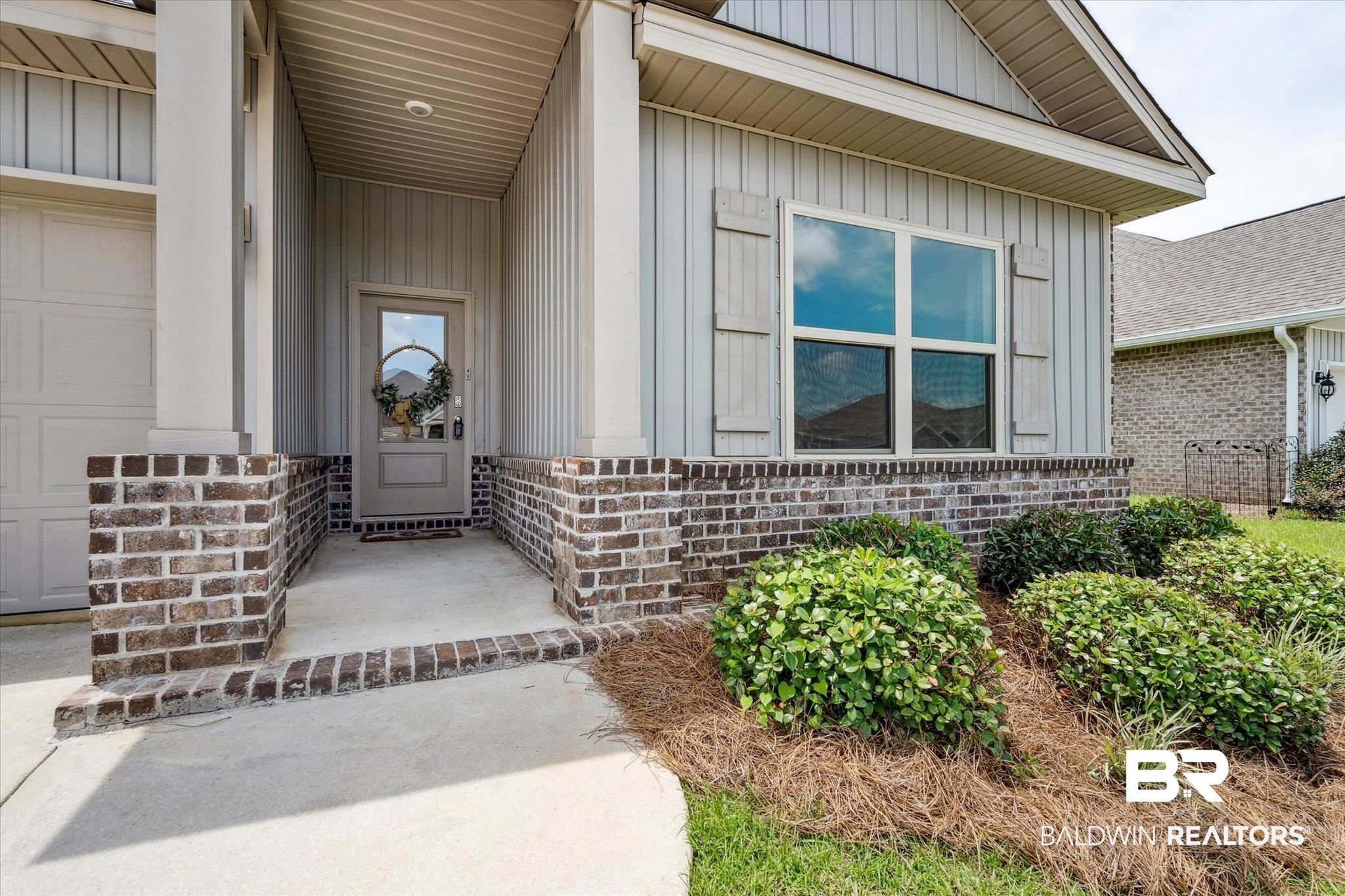 10501 Loamy Avenue Mobile, AL 36695 - Photo 2 of 30 Property entrance featuring a garage