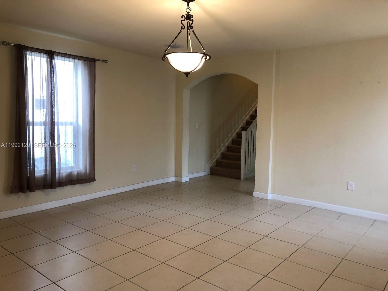 17000 Southwest 90th Terrace Miami, FL 33196 - Photo 2 of 56 a view of an empty room with a window