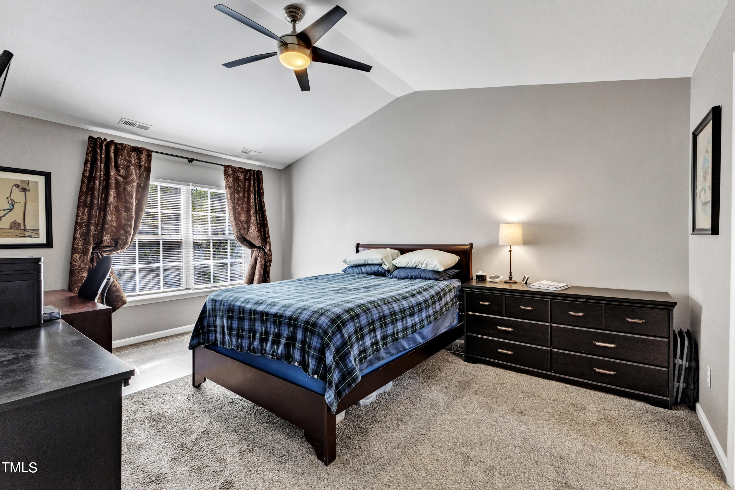 7 Epping Court Durham, NC 27703 - Photo 12 of 35 a bedroom with a bed and a window
