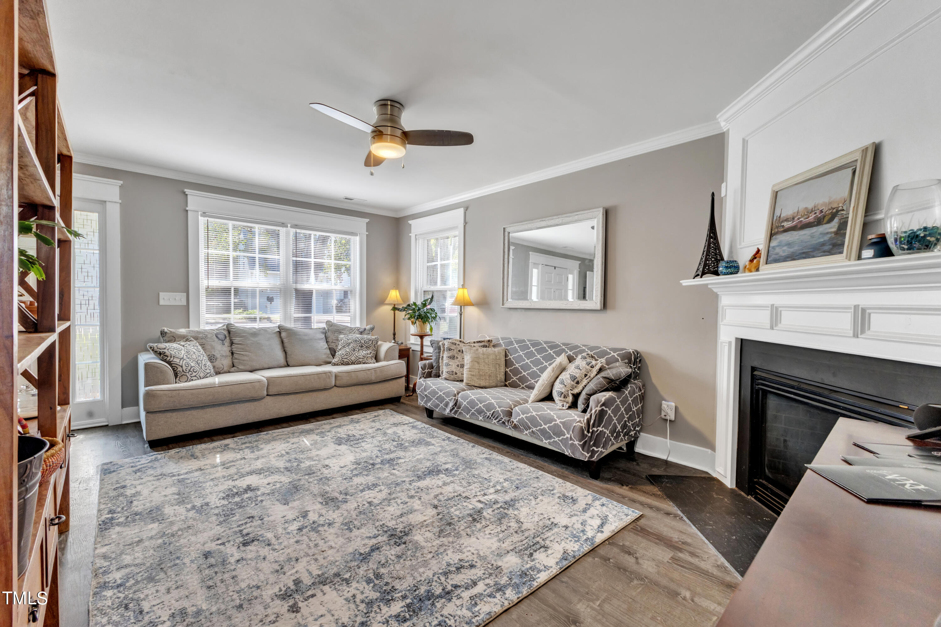 7 Epping Court Durham, NC 27703 - Photo 3 of 35 a living room with furniture and a fireplace