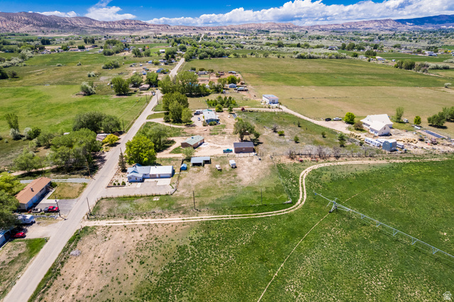 1043 East 4000th Street South Vernal, UT 84078 - Photo 25 of 31 Expansive rural setting featuring verdant fields and distant mountains