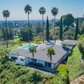 a view of an outdoor sitting area with furniture
