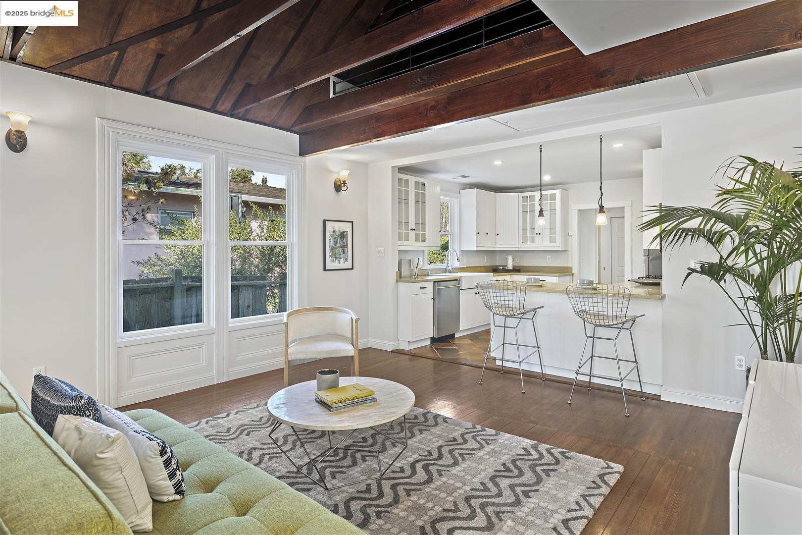 2439 Tenth Street, Unit B Berkeley, CA 94710 - Photo 2 of 16 a living room with furniture and a wooden floor