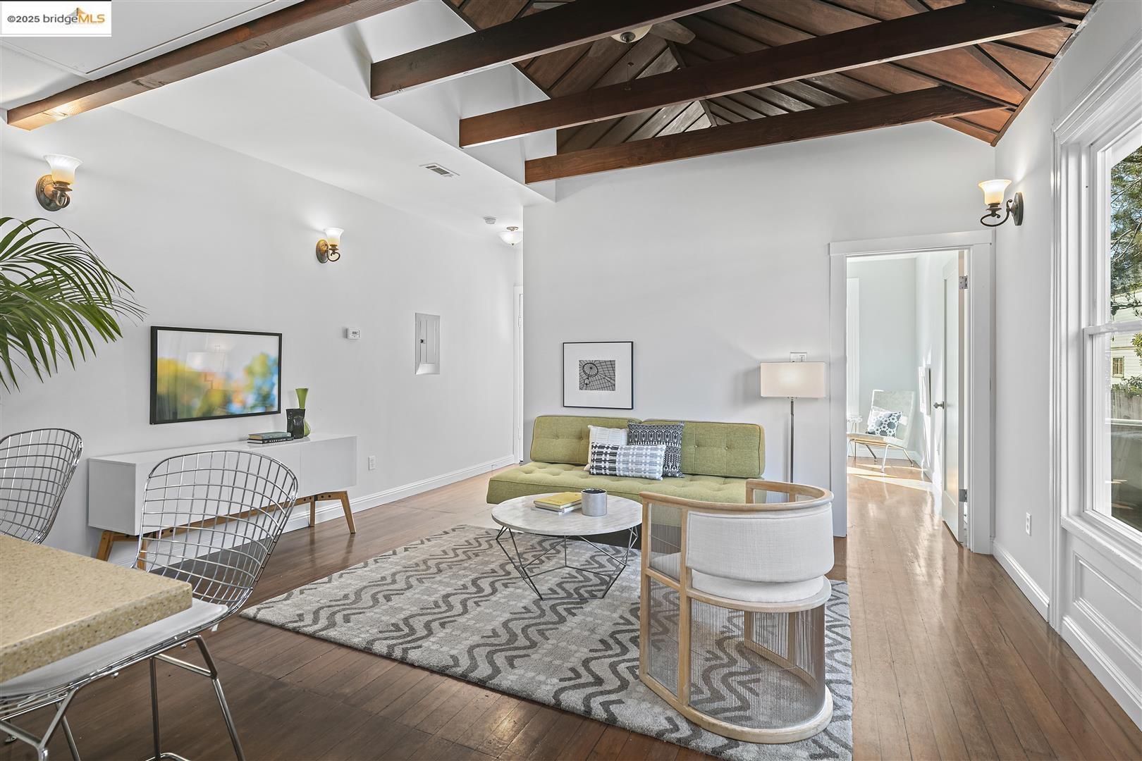 2439 Tenth Street, Unit B Berkeley, CA 94710 - Photo 4 of 16 a living room with furniture and wooden floor