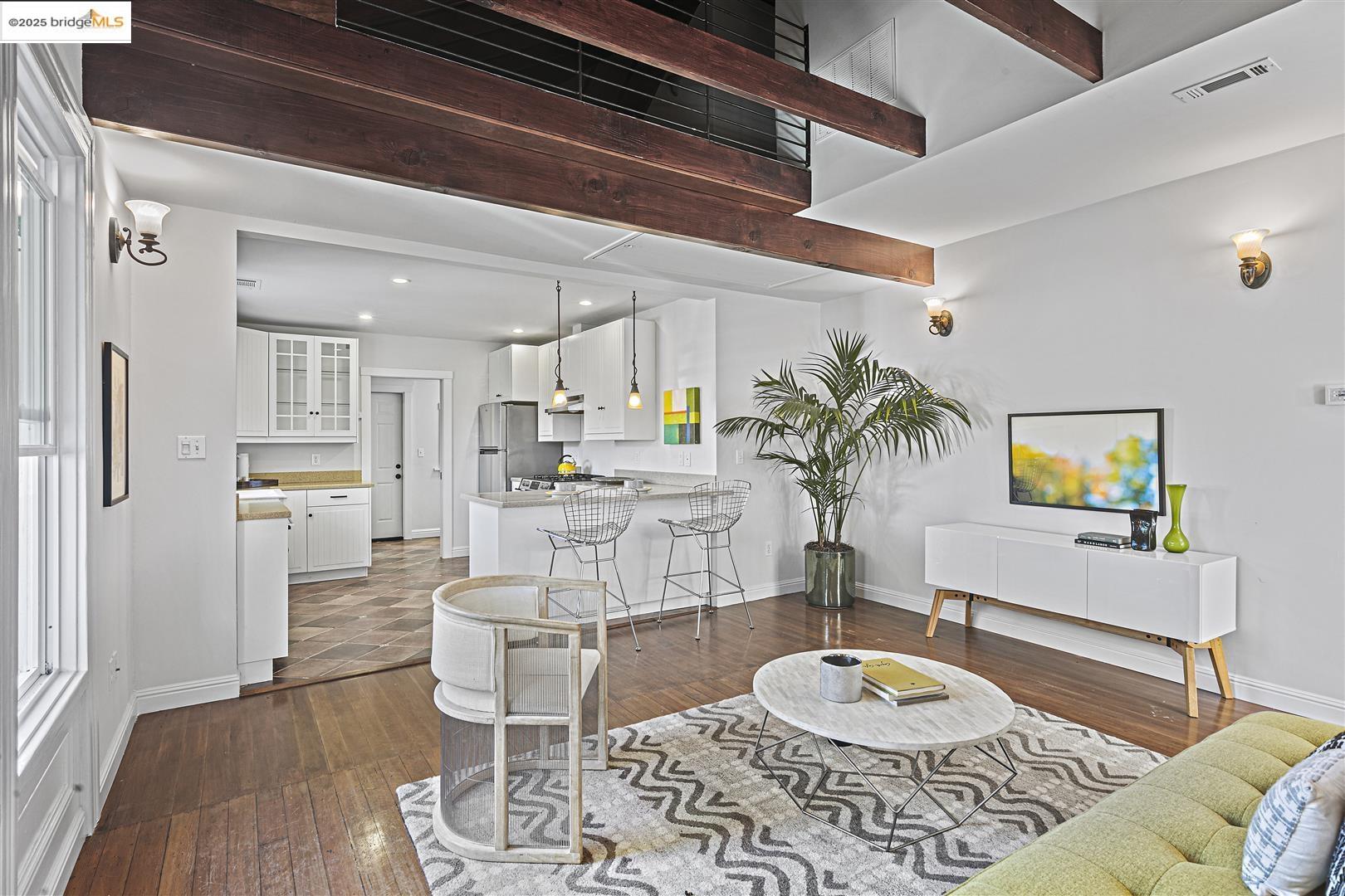 2439 Tenth Street, Unit B Berkeley, CA 94710 - Photo 5 of 16 a living room with furniture and a wooden floor