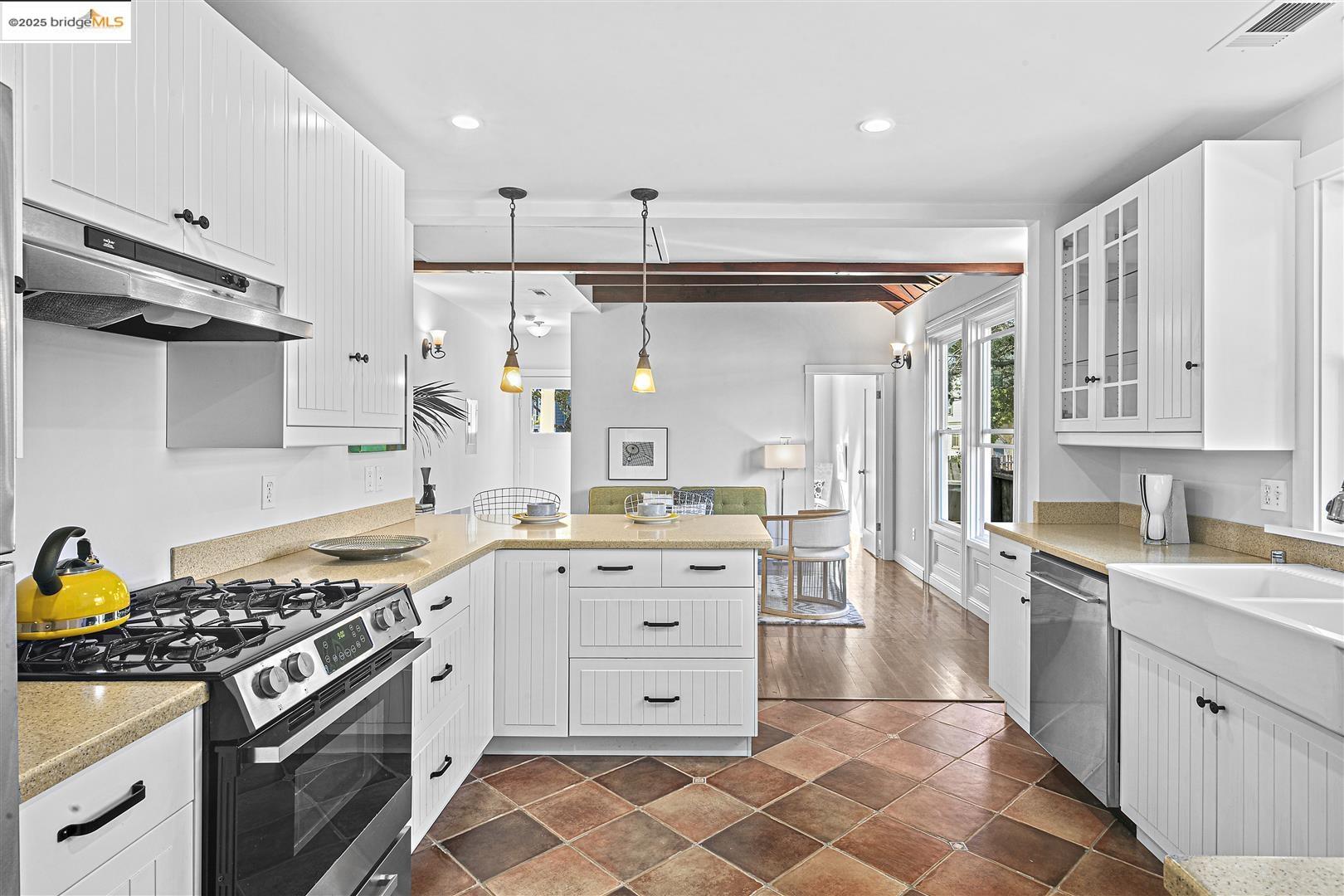 2439 Tenth Street, Unit B Berkeley, CA 94710 - Photo 8 of 16 a kitchen with stainless steel appliances a stove a sink and a refrigerator