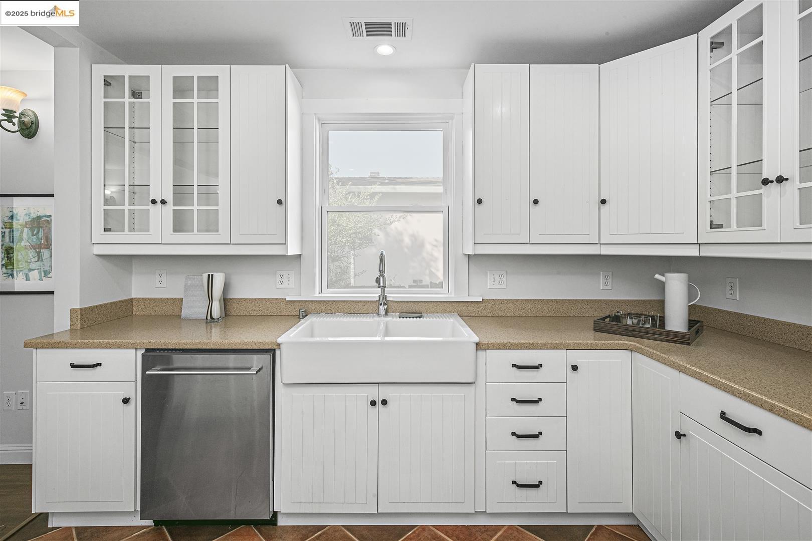 2439 Tenth Street, Unit B Berkeley, CA 94710 - Photo 9 of 16 a kitchen with stainless steel appliances granite countertop a sink dishwasher and cabinets with wooden floor