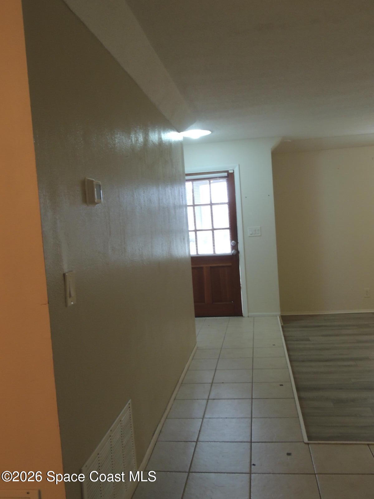 1312 Huntington Lane Rockledge, FL 32955 - Photo 3 of 21 a view of hallway with a window