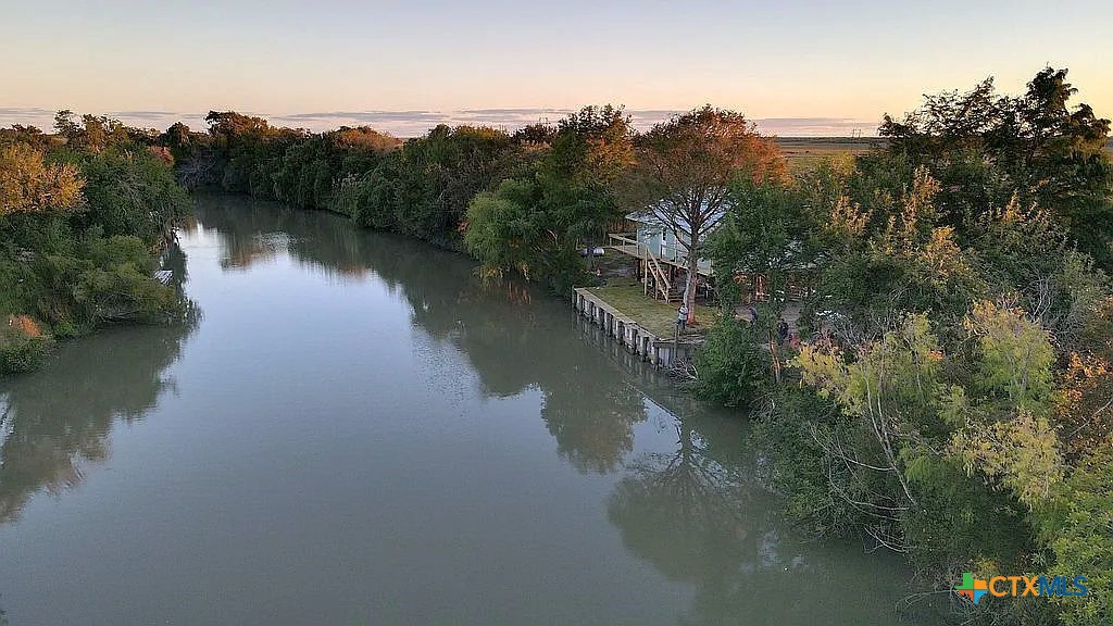 109 River Road Tivoli, TX 77990 - Photo 1 of 39 a view of a lake in middle of forest