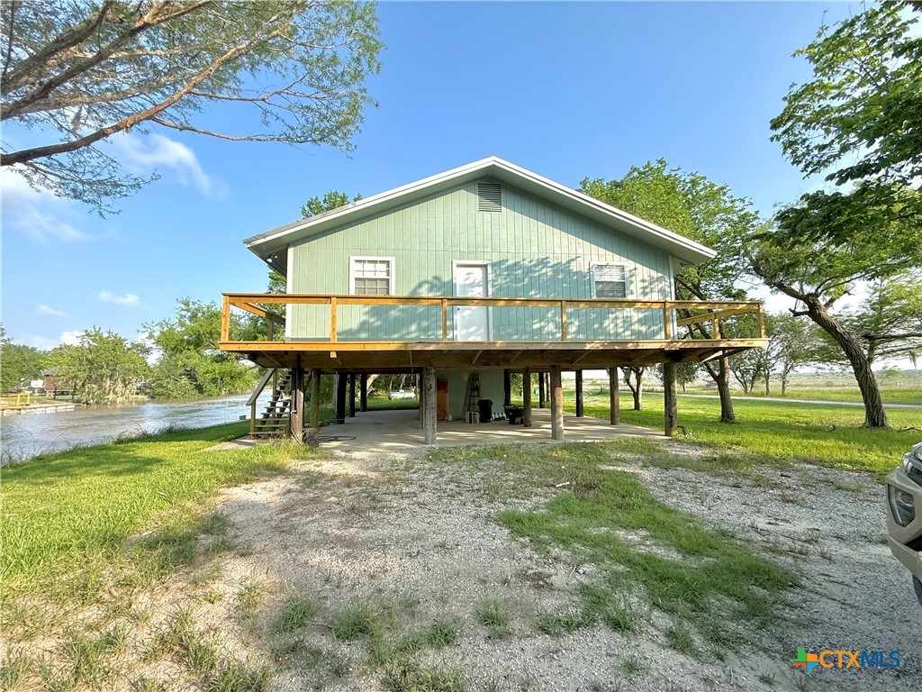 109 River Road Tivoli, TX 77990 - Photo 2 of 39 a front view of a house with a yard table and chairs