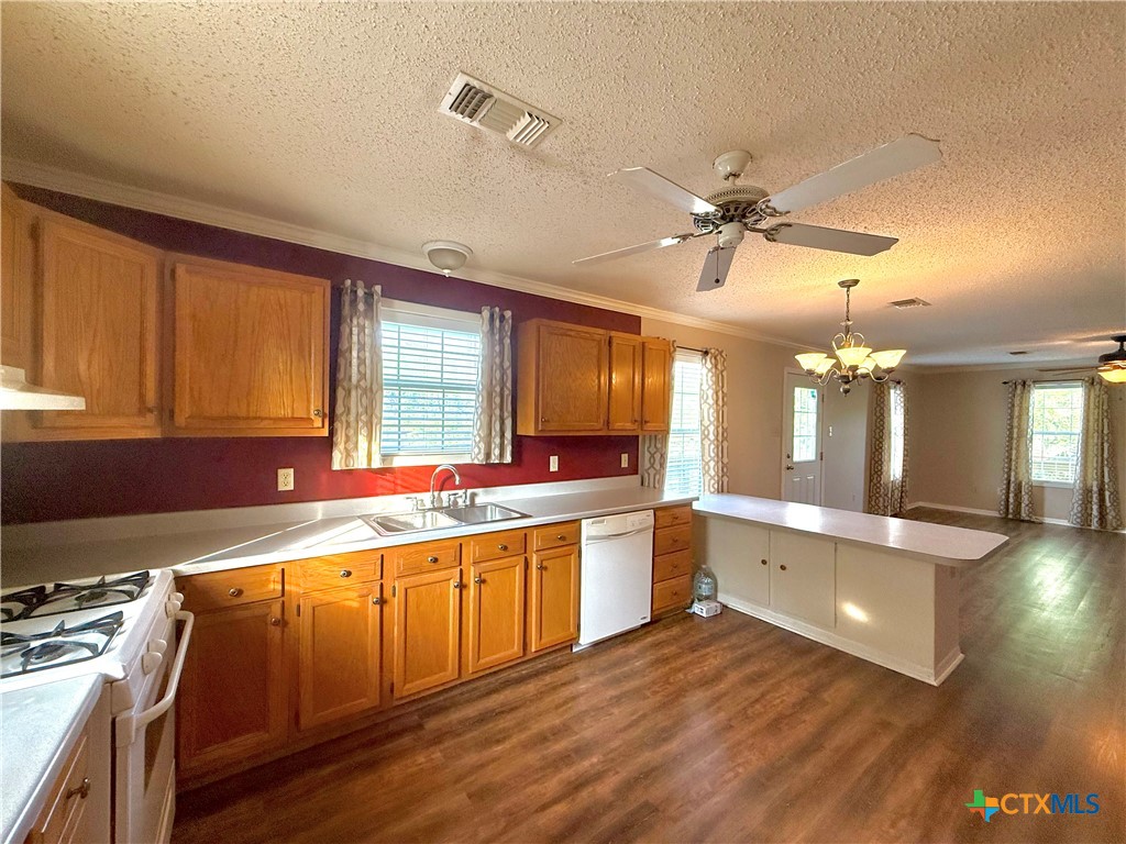 109 River Road Tivoli, TX 77990 - Photo 24 of 39 a large kitchen with a large counter top space appliances and a window
