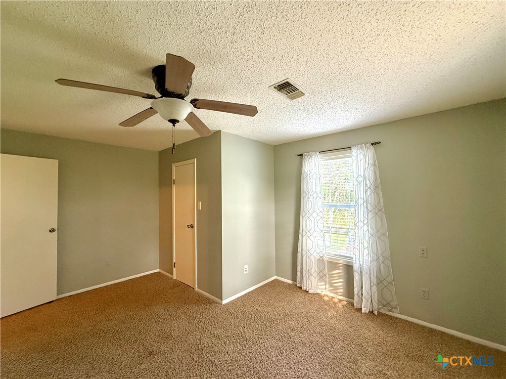 109 River Road Tivoli, TX 77990 - Photo 25 of 39 a view of a livingroom with a ceiling fan and window
