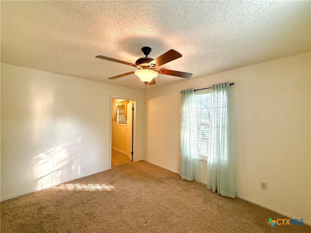 109 River Road Tivoli, TX 77990 - Photo 28 of 39 a view of a livingroom with a ceiling fan and window