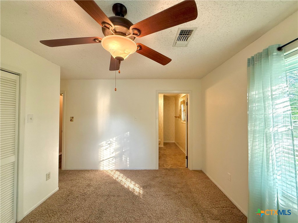 109 River Road Tivoli, TX 77990 - Photo 29 of 39 en view interior of the house and window with ceiling fan