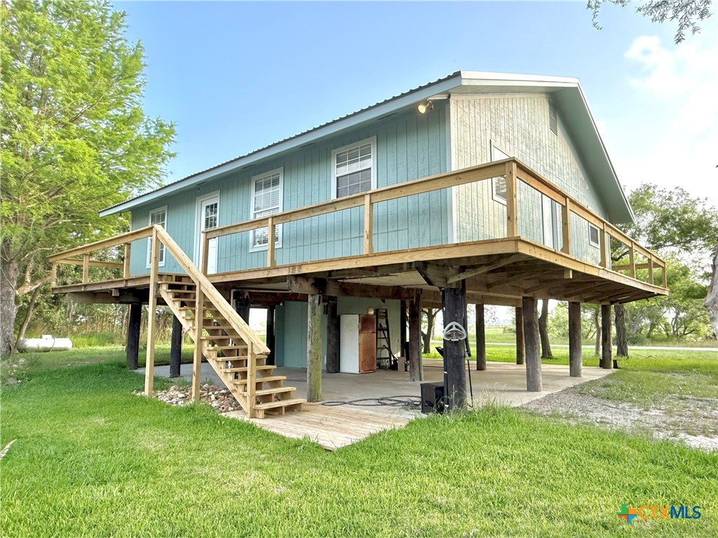 109 River Road Tivoli, TX 77990 - Photo 8 of 39 a front view of a house with a yard