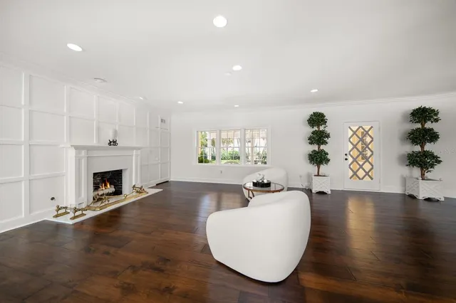 a lobby with furniture and a chandelier