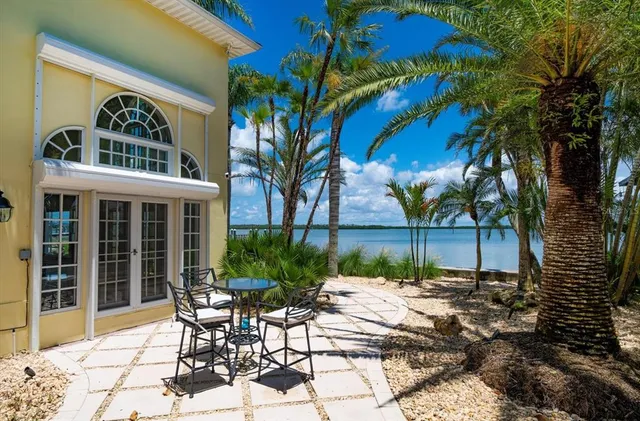 a kitchen with stainless steel appliances white cabinets and wooden floors