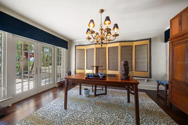 a room with furniture a rug and white walls