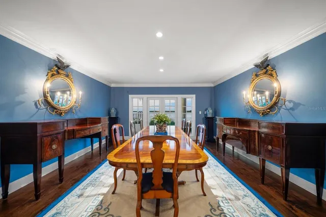 a living room with lots of furniture and baby crib