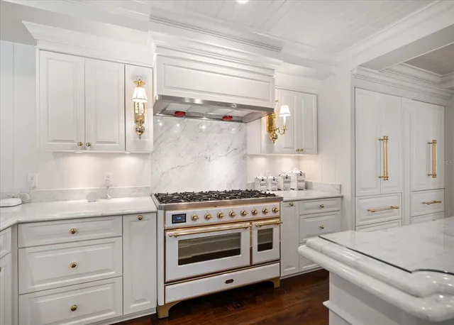 a view of swimming pool with outdoor seating and plants