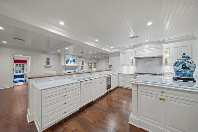 a view of a swimming pool with outdoor seating