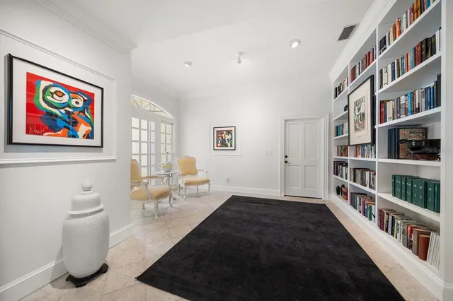 an aerial view of a residential houses with outdoor space and lake view