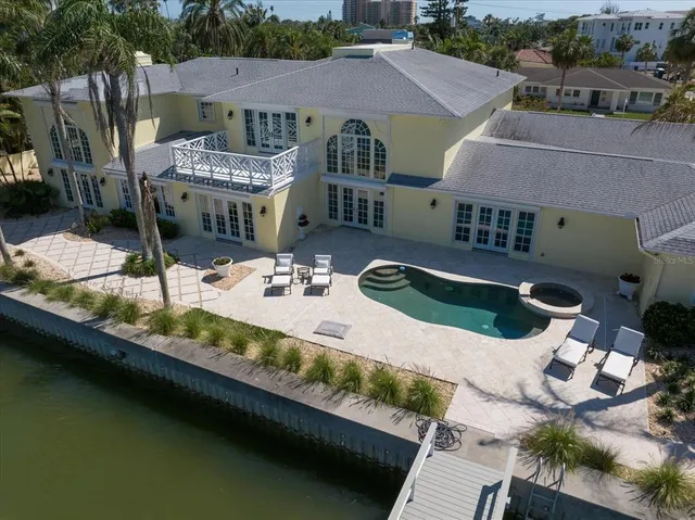 a view of a yard in front of a house with a fountain