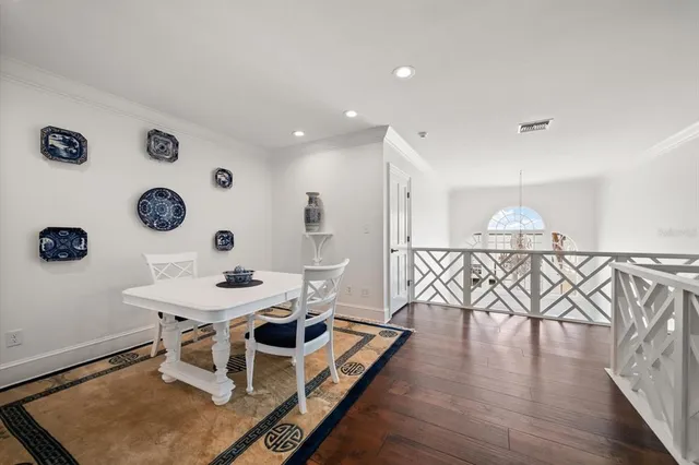 a view of a house with a small yard and a patio