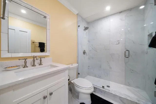 a view of a house with swimming pool and sitting area