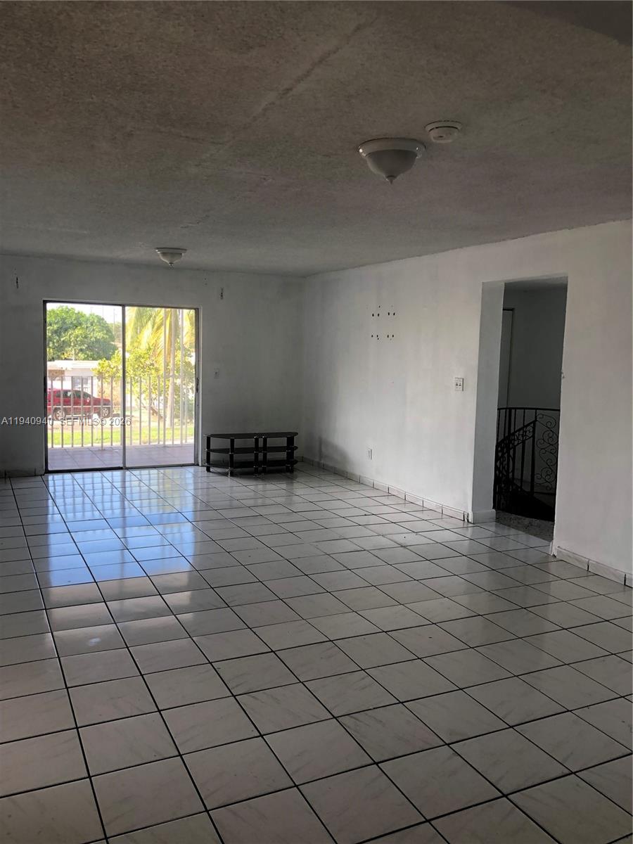 992 East 18th Street Hialeah, FL 33013 - Photo 3 of 5 a view of an empty room and a window