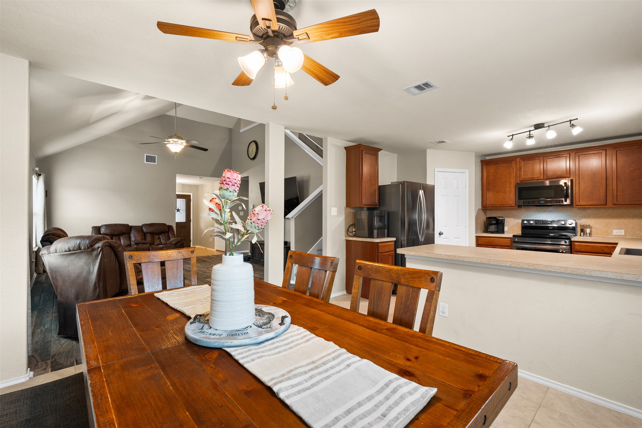 137 Barn Owl Loop Leander, TX 78641 - Photo 19 of 36 a view of a dining room with furniture a rug and wooden floor