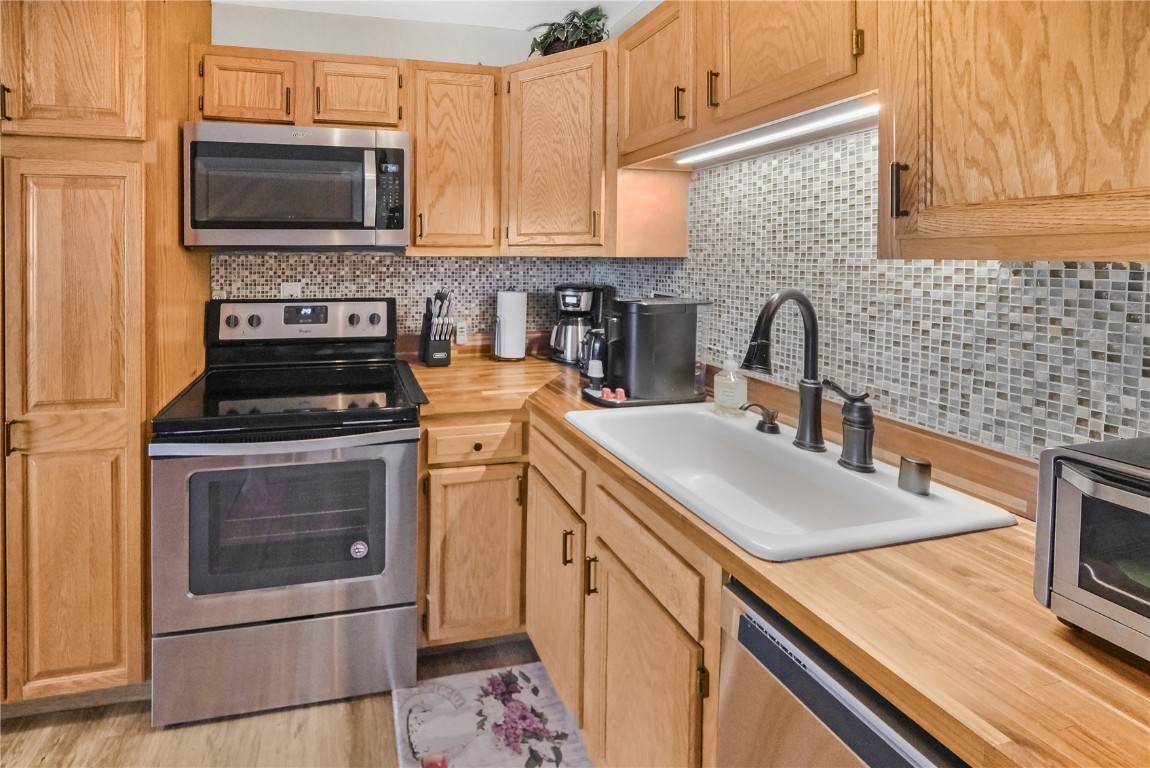 150 Evergreen Road, Unit C303 Dillon, CO 80435 - Photo 2 of 35 a kitchen with granite countertop a sink stove and microwave