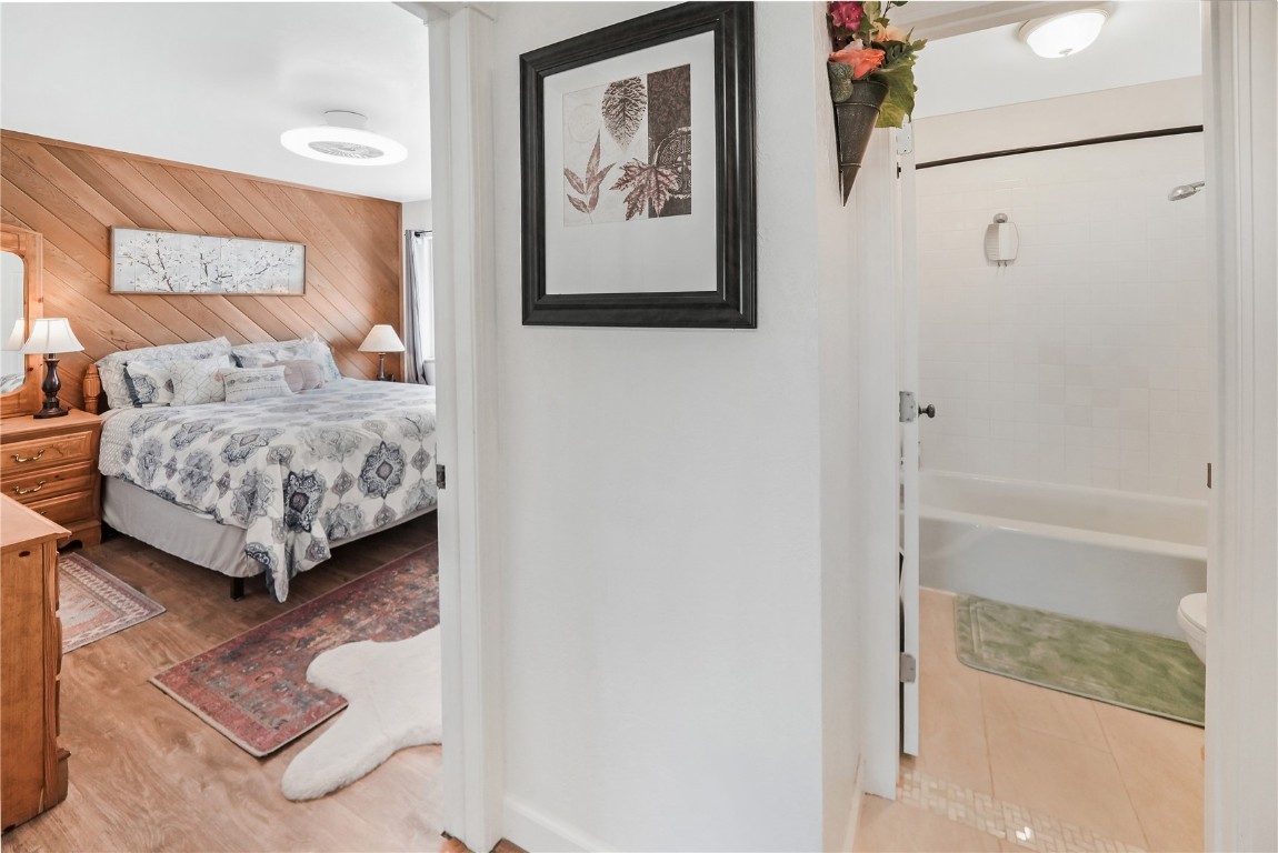 150 Evergreen Road, Unit C303 Dillon, CO 80435 - Photo 23 of 35 a bedroom with a bed and a painting on the wall