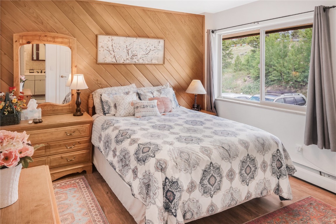 150 Evergreen Road, Unit C303 Dillon, CO 80435 - Photo 24 of 35 a large bed sitting in a bedroom next to a window