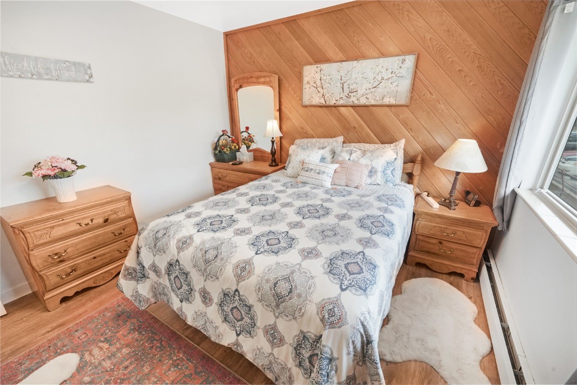 150 Evergreen Road, Unit C303 Dillon, CO 80435 - Photo 27 of 35 a bedroom with a bed and a dresser