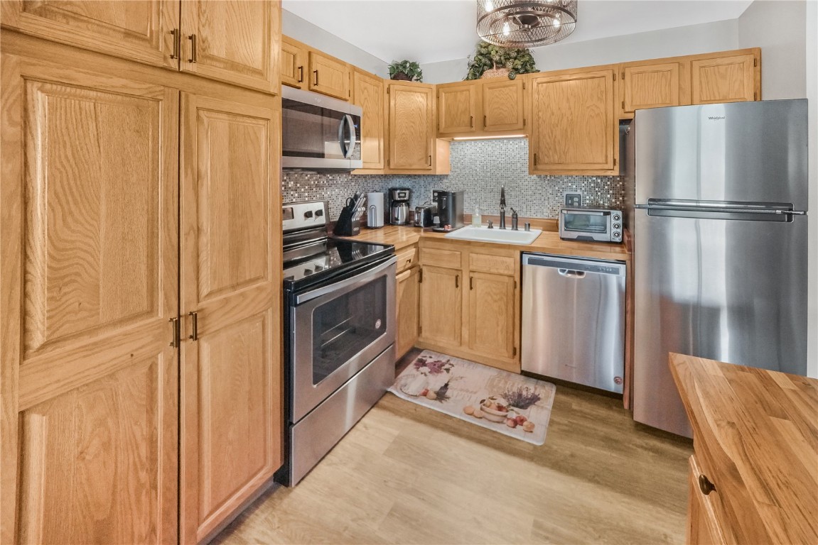 150 Evergreen Road, Unit C303 Dillon, CO 80435 - Photo 3 of 35 a kitchen with stainless steel appliances granite countertop a refrigerator stove and sink